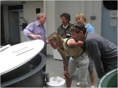 Dr. Richard Pipe showing an experimental tank at the MBA to the Sorcerer II crew: Captain Charlie Howard, Jeremy Niles (Back row), Karen McNish and John Henke (front row).